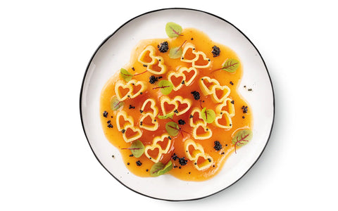 Heart-shaped pasta with mango and orange gazpacho with fish eggs